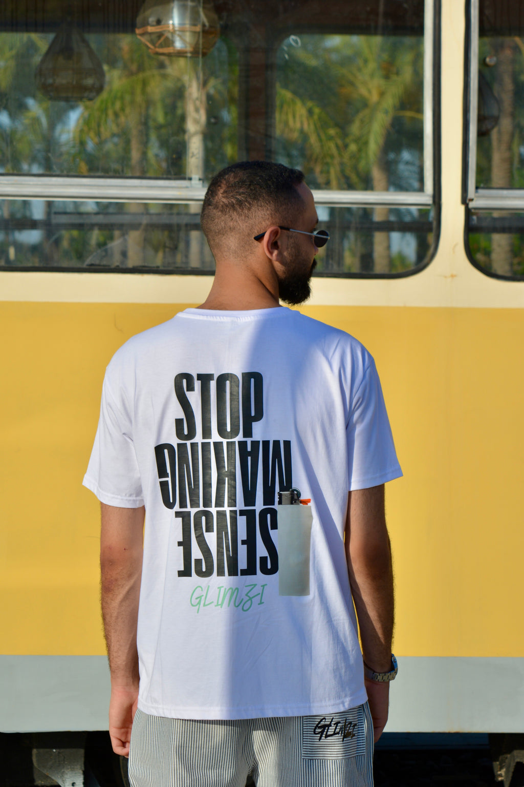 "STOP MAKING SENSE" Unisex Graphic T-shirt.